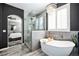 Bright bathroom featuring a freestanding tub, glass shower, and elegant chandelier at 8548 Winter Berry Dr, Castle Pines, CO 80108