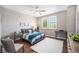 Bedroom featuring wood floors, gray walls, and lots of natural light at 8548 Winter Berry Dr, Castle Pines, CO 80108