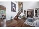 Spacious foyer with soaring ceilings, hardwood floors, a staircase, and an elegant dining area beyond at 8548 Winter Berry Dr, Castle Pines, CO 80108