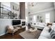 Bright living room features high ceilings, a fireplace, and comfortable seating at 8548 Winter Berry Dr, Castle Pines, CO 80108