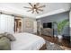Relaxing main bedroom featuring an ensuite bathroom, a large bed, and a calming color palette at 8548 Winter Berry Dr, Castle Pines, CO 80108