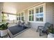 Relaxing front porch featuring outdoor seating, a patterned rug, and ample space for enjoying the outdoors at 8548 Winter Berry Dr, Castle Pines, CO 80108