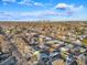 This aerial view displays the residential neighborhood, streets, and distant Denver skyline at 1250 S Tennyson St, Denver, CO 80219