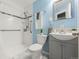 Modern bathroom with a walk-in shower, updated fixtures, and a sleek, stylish vanity at 1250 S Tennyson St, Denver, CO 80219