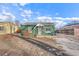 Charming green home with a well-maintained front yard and a cozy, inviting entryway at 1250 S Tennyson St, Denver, CO 80219