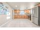 Bright kitchen featuring light wood cabinets, modern appliances, and ample countertop space at 1250 S Tennyson St, Denver, CO 80219