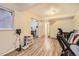 Open basement area with laminate flooring, flexible for recreation, storage, or additional living space at 14193 E Radcliff Cir, Aurora, CO 80015