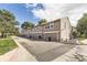 Exterior view of townhomes with garage doors, offering convenient parking and curb appeal at 14193 E Radcliff Cir, Aurora, CO 80015