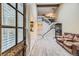 Bright living room featuring vaulted ceiling, hardwood floors, and an open staircase at 14193 E Radcliff Cir, Aurora, CO 80015