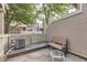 Private outdoor patio with a bench and seating area, perfect for enjoying fresh air and relaxation at 14193 E Radcliff Cir, Aurora, CO 80015