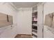 Spacious walk-in closet with organized shelving, ample storage, and room for all your fashion essentials at 14193 E Radcliff Cir, Aurora, CO 80015