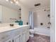 Well-lit bathroom featuring a white vanity, ample storage, and a shower-tub combination at 13908 E Linvale Pl, Aurora, CO 80014
