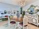 Elegant dining room featuring a chandelier and stylish furniture, perfect for entertaining at 13908 E Linvale Pl, Aurora, CO 80014