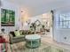 Open-concept living room with stylish decor, modern furnishings, and ample natural light at 13908 E Linvale Pl, Aurora, CO 80014