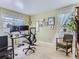 Home office with natural light, a sit/stand desk, and a comfortable chair at 13908 E Linvale Pl, Aurora, CO 80014