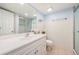 Bright bathroom with a white vanity, tiled walls, and a glass-enclosed shower at 14204 E Baltic Cir, Aurora, CO 80014