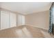 Empty bedroom with wood floors and double closets at 14204 E Baltic Cir, Aurora, CO 80014