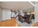 Bright dining room with hardwood floors, glass table, and staircase view at 14204 E Baltic Cir, Aurora, CO 80014