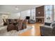 Dining area with hardwood floors, glass table, and large mirror at 14204 E Baltic Cir, Aurora, CO 80014