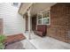 Front entryway with brick accents and a small seating area at 14204 E Baltic Cir, Aurora, CO 80014