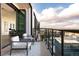 Private balcony with city views and seating area at 1750 Wewatta St # 1940, Denver, CO 80202