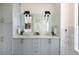 Modern bathroom with double vanity and marble tile at 1750 Wewatta St # 1940, Denver, CO 80202