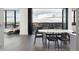 Modern dining room with access to balcony and city views at 1750 Wewatta St # 1940, Denver, CO 80202