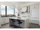 Modern kitchen with island and stunning city views at 1750 Wewatta St # 1940, Denver, CO 80202