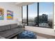 Spacious living room with city views and comfortable seating at 1750 Wewatta St # 1940, Denver, CO 80202