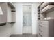 Large walk-in closet with ample shelving and hanging space at 1750 Wewatta St # 1940, Denver, CO 80202