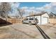 Gravel driveway leads to a detached garage in the backyard at 2421 Eliot St, Denver, CO 80211