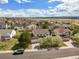 Suburban neighborhood, two-story home, large lawn, with a view of mountains in the distance at 5934 Kingsfield St, Castle Rock, CO 80104