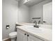 Bathroom featuring a white vanity with a black faucet and large mirror at 5934 Kingsfield St, Castle Rock, CO 80104