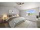 Primary bedroom features a vaulted ceiling, large window, and neutral decor at 5934 Kingsfield St, Castle Rock, CO 80104