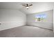 Large bedroom with a vaulted ceiling and a large window providing ample natural light at 5934 Kingsfield St, Castle Rock, CO 80104