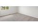 Bright bedroom features neutral carpet, paint, and window at 5934 Kingsfield St, Castle Rock, CO 80104