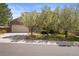 Charming two-story home featuring a brick facade, covered porch, and lush front lawn at 5934 Kingsfield St, Castle Rock, CO 80104