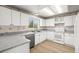 Classic kitchen with white cabinets, granite countertops, and stainless steel appliances at 5934 Kingsfield St, Castle Rock, CO 80104
