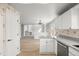 Open kitchen design with hardwood floors and views into the fireplace living room at 5934 Kingsfield St, Castle Rock, CO 80104