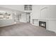 Spacious living room features a fireplace, neutral tones, and staircase access at 5934 Kingsfield St, Castle Rock, CO 80104