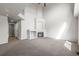 Bright living room features a fireplace, high ceilings, neutral tones, and staircase access at 5934 Kingsfield St, Castle Rock, CO 80104