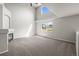 Living area with fireplace, vaulted ceiling, and large window offering ample natural light at 5934 Kingsfield St, Castle Rock, CO 80104