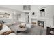 Inviting living room with a cozy fireplace, comfortable seating, and modern decor accents at 5934 Kingsfield St, Castle Rock, CO 80104