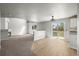 Open-concept living area with a fireplace, sliding glass doors to the backyard, and eat in kitchen at 5934 Kingsfield St, Castle Rock, CO 80104