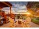 Inviting backyard patio seating with sunset views, perfect for relaxing and entertaining outdoors at 9537 Chesapeake St, Highlands Ranch, CO 80126