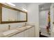 Modern bathroom featuring double sinks, a granite countertop, and a shower-tub combination at 9537 Chesapeake St, Highlands Ranch, CO 80126