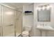 Bright bathroom features a glass shower, a modern vanity, and sleek fixtures at 9537 Chesapeake St, Highlands Ranch, CO 80126