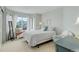 Bright bedroom with large windows, a cozy window seat, and a calming color palette at 9537 Chesapeake St, Highlands Ranch, CO 80126