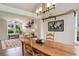 Cozy dining room with natural light, hardwood floors, and open to the living area at 9537 Chesapeake St, Highlands Ranch, CO 80126