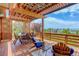 Relaxing patio with pergola, outdoor seating, and expansive backyard views perfect for entertaining at 9537 Chesapeake St, Highlands Ranch, CO 80126